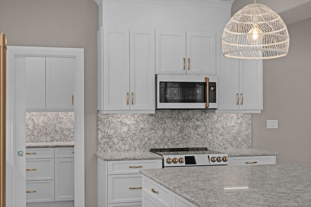 Real estate photography Kingston Ontario bright kitchen with gold hardware